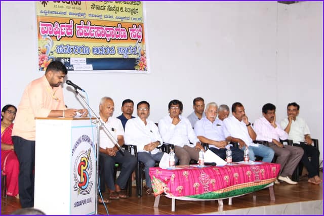 A speaker addressing members at the general body meeting